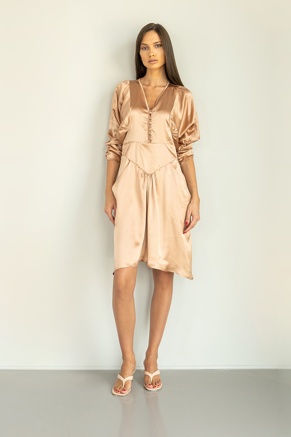 Nude silk mini dress with balloon sleeves and buttons