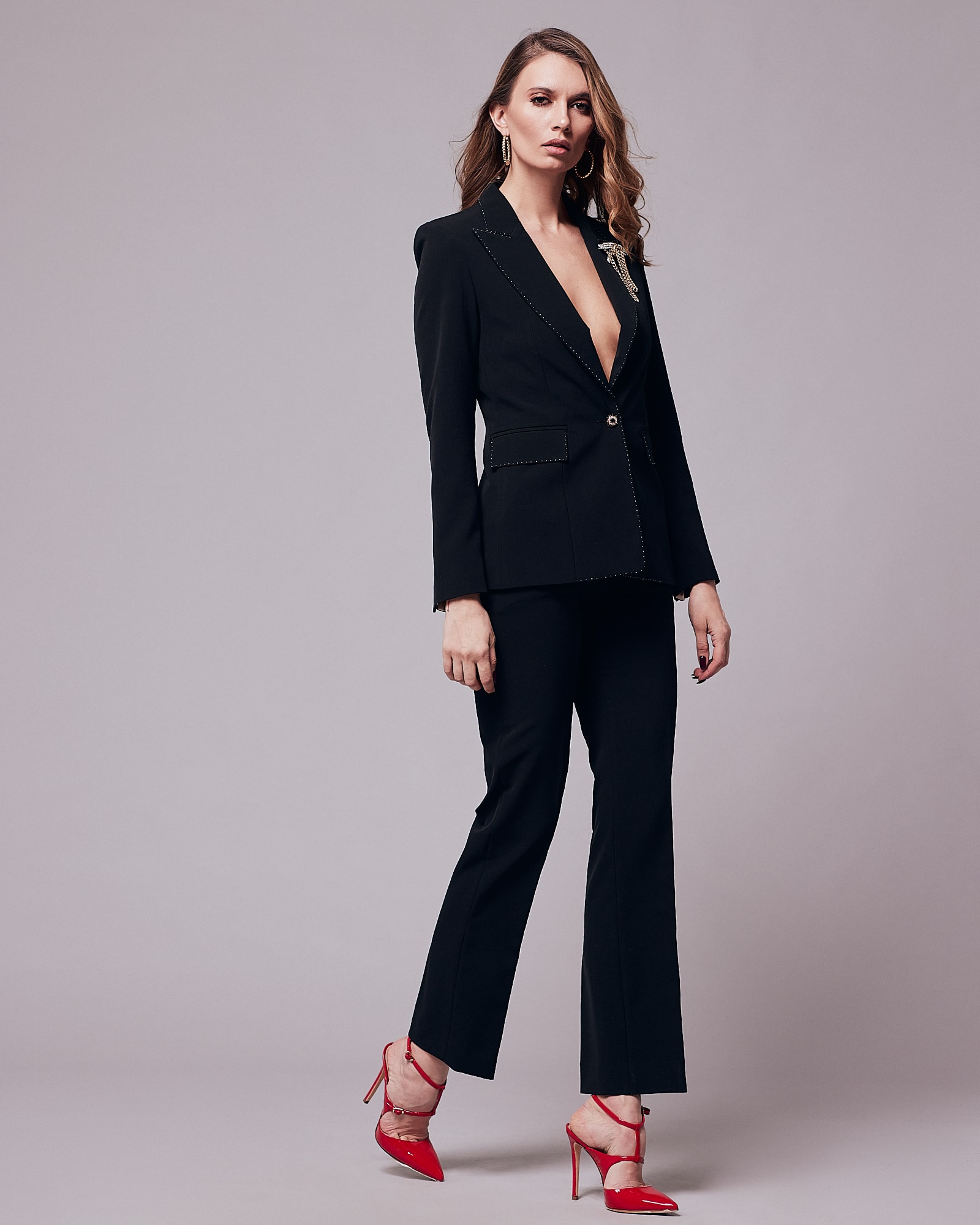 One button black suit with white stitching